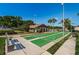 Outdoor shuffleboard court with seating at 1882 Pine Ridge W Way # E1, Palm Harbor, FL 34684