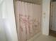 Bathroom with shower and floral shower curtain at 1950 59Th N Ave # 110, St Petersburg, FL 33714