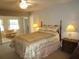 Main bedroom with queen bed and access to sunroom at 1950 59Th N Ave # 110, St Petersburg, FL 33714