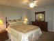 Comfortable bedroom with ceiling fan and wood furniture at 1950 59Th N Ave # 110, St Petersburg, FL 33714