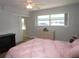 Bedroom with large windows, double closets and ceiling fan at 1950 59Th N Ave # 110, St Petersburg, FL 33714