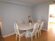 Dining room with a white table and six chairs at 1950 59Th N Ave # 110, St Petersburg, FL 33714