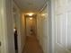 Light-filled hallway with carpet and access to multiple rooms at 1950 59Th N Ave # 110, St Petersburg, FL 33714