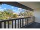 Private balcony overlooking a lake and community at 1955 Whitney Way, Clearwater, FL 33760