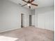 Spacious bedroom with ceiling fan and large closet at 1955 Whitney Way, Clearwater, FL 33760