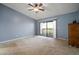 Bright bedroom with private balcony access at 1955 Whitney Way, Clearwater, FL 33760