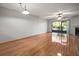 Living room with hardwood floors, fireplace and sliding doors at 1955 Whitney Way, Clearwater, FL 33760