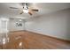 Living room with hardwood floors and ceiling fan at 1955 Whitney Way, Clearwater, FL 33760