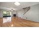 Living room with hardwood floors, fireplace and staircase at 1955 Whitney Way, Clearwater, FL 33760