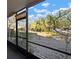 Relaxing screened porch overlooking a pond at 1955 Whitney Way, Clearwater, FL 33760