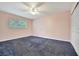 Spacious bedroom with neutral walls and plush carpeting at 2 N Fernwood Ave # 16, Clearwater, FL 33765