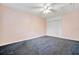 Well-lit bedroom featuring ceiling fan and ample closet space at 2 N Fernwood Ave # 16, Clearwater, FL 33765