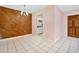 Dining area with wood wall and chandelier at 2 N Fernwood Ave # 16, Clearwater, FL 33765