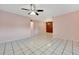 Bright living room with tile floors and ceiling fan at 2 N Fernwood Ave # 16, Clearwater, FL 33765