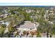 Aerial view of a single-Gathering home nestled in a tree-lined neighborhood at 2004 Virginia Dr, Bradenton, FL 34205