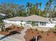 Aerial view of a single-Gathering home with a landscaped yard and a paved driveway at 2004 Virginia Dr, Bradenton, FL 34205