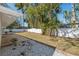 Landscaped backyard with patio and stepping stones at 2004 Virginia Dr, Bradenton, FL 34205