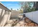 Brick pathway meanders through a nicely landscaped backyard with gravel and woodchips at 2004 Virginia Dr, Bradenton, FL 34205