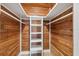 Spacious closet with wood-paneled walls and built-in shelving at 2004 Virginia Dr, Bradenton, FL 34205