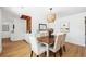 Modern dining room with wood table and white cabinetry at 2004 Virginia Dr, Bradenton, FL 34205