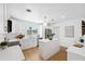 Modern white kitchen with island and stainless steel appliances at 2004 Virginia Dr, Bradenton, FL 34205