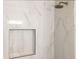 Shower with marble-style tile and built-in niche at 2004 Virginia Dr, Bradenton, FL 34205