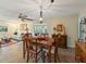 Bright dining area with wooden table and chairs, adjacent to living room at 2022 Hawkhurst Cir, Sun City Center, FL 33573