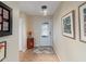 Bright entryway with tiled floor and decor at 2022 Hawkhurst Cir, Sun City Center, FL 33573