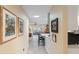 View of kitchen and living area from hallway at 2022 Hawkhurst Cir, Sun City Center, FL 33573