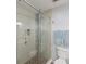 Walk-in shower with glass door and mosaic tile at 2022 Hawkhurst Cir, Sun City Center, FL 33573