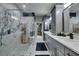 Elegant bathroom with gray cabinets and marble shower at 204 Latitude Pl, Apollo Beach, FL 33572