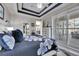 Bright bedroom with white plantation shutters and a view of the backyard at 204 Latitude Pl, Apollo Beach, FL 33572