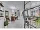 Bright dining room features a glass-top table, four chairs, and stylish wall art at 204 Latitude Pl, Apollo Beach, FL 33572