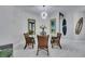 Casual dining area with four chairs and a round glass table at 204 Latitude Pl, Apollo Beach, FL 33572