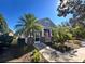 Charming house exterior featuring a screened porch and walkway at 204 Latitude Pl, Apollo Beach, FL 33572