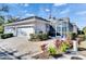 Two-car garage, screened patio, and landscaped yard at 204 Latitude Pl, Apollo Beach, FL 33572