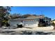 Two-car garage with paver driveway and landscaping at 204 Latitude Pl, Apollo Beach, FL 33572