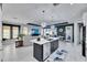 Modern kitchen with a large island and white cabinets at 204 Latitude Pl, Apollo Beach, FL 33572