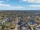 Wide aerial showing a neighborhood with houses, trees, and a road at 2300 Lancaster Dr, Clearwater, FL 33764