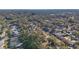 Aerial perspective of a neighborhood featuring houses nestled amongst trees at 2300 Lancaster Dr, Clearwater, FL 33764