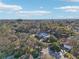 An aerial view of a residential area featuring houses and landscaping at 2300 Lancaster Dr, Clearwater, FL 33764