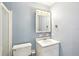 Bathroom with white vanity, medicine cabinet, and shower at 2300 Lancaster Dr, Clearwater, FL 33764