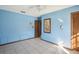 Blue bedroom with tile floors, ceiling fan, and window at 2300 Lancaster Dr, Clearwater, FL 33764