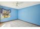 Blue bedroom with tile floors and ceiling fan at 2300 Lancaster Dr, Clearwater, FL 33764