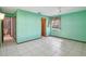 Bright bedroom with tile floors and access to bathroom at 2300 Lancaster Dr, Clearwater, FL 33764