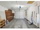 Garage with cabinets, shelving, and workshop area at 2300 Lancaster Dr, Clearwater, FL 33764