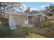 Exterior view of house with screened patio at 2300 Lancaster Dr, Clearwater, FL 33764