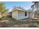 Side view of house with yard and shed at 2300 Lancaster Dr, Clearwater, FL 33764