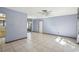 Spacious living area with tile floors and ceiling fan at 2300 Lancaster Dr, Clearwater, FL 33764