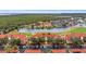 Condo building with water, golf course and distant city views at 2400 Feather Sound Dr # 913, Clearwater, FL 33762